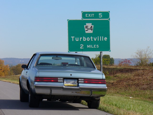 buick turbo t next to turbotville sign