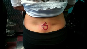 buick power 6 logo tattoo on womans back
